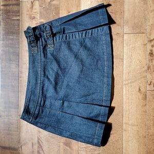 Denim mini skirt with pleats and buckles